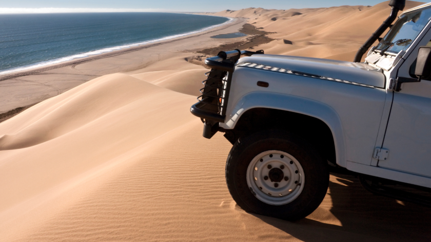 4x4 vehicle parked at Sandwich Harbour, Namibia.