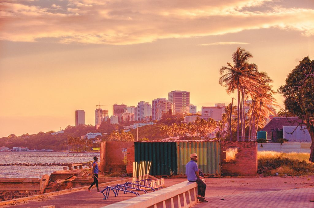 A view of a beach in Maputo at sunset.