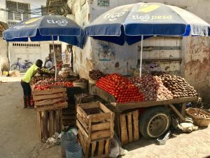 Fruit vendor in Stone Town, Zanzibar | Photo credits: The Magic of Traveling