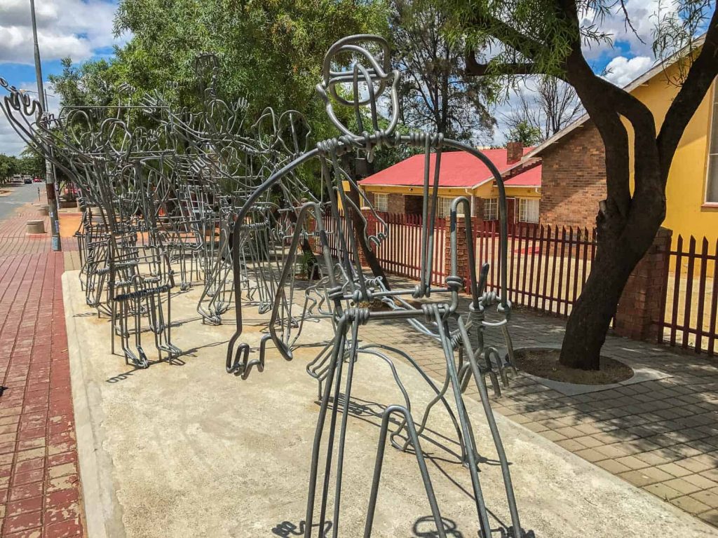 Sculpture in Soweto depicting the uprising of school children in 1976 | Photo Credits- Never Ending Voyage