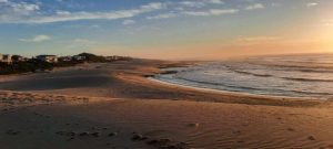 Sunset on a beach at Cannon Rocks, South Africa | Photo credits: Port Alfred, South Africa | Photo credits: Adventure Travel Coach