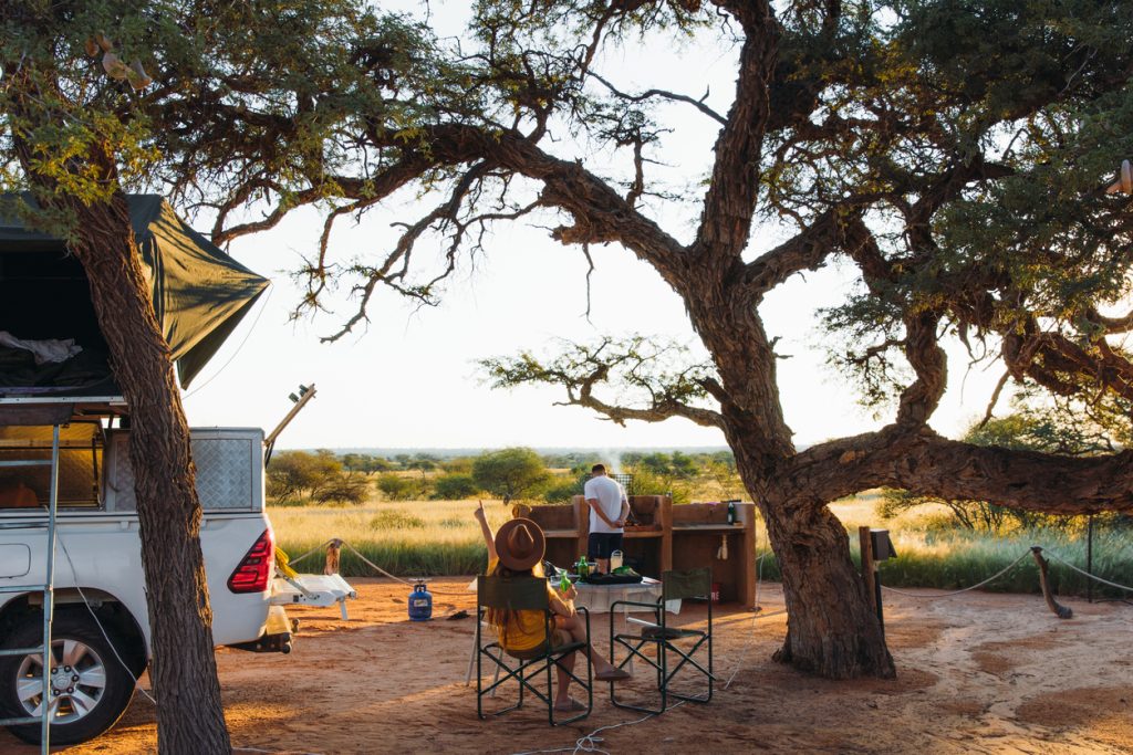Tourists camping in Namibia on a self-drive holiday.
