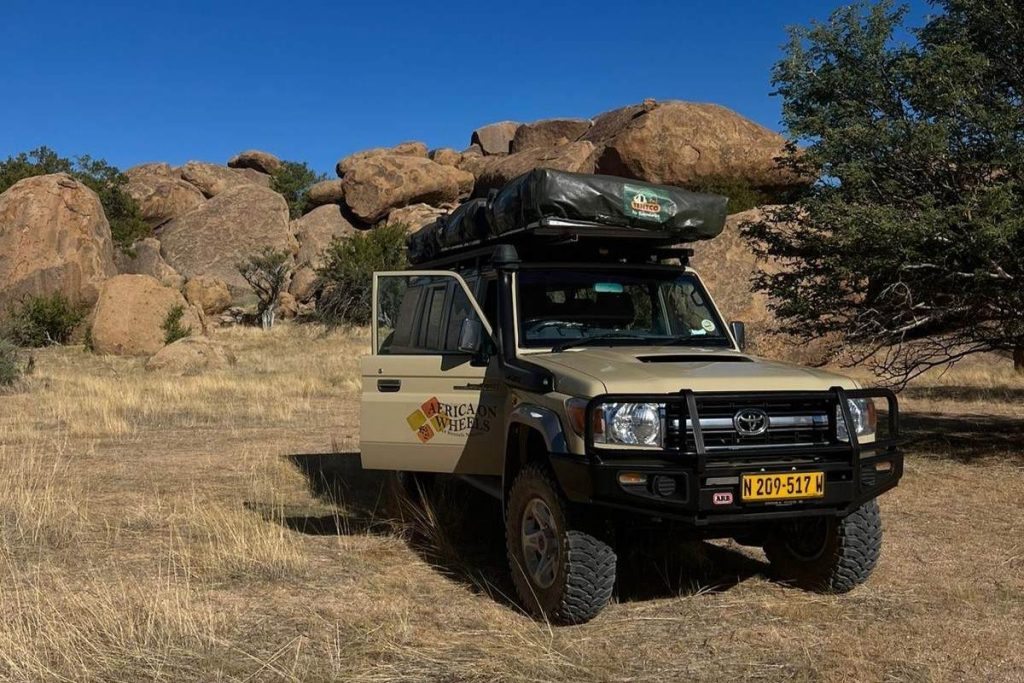 The Land Cruiser HJ 76 4x4 rental in Namibia at Spitzkoppe.