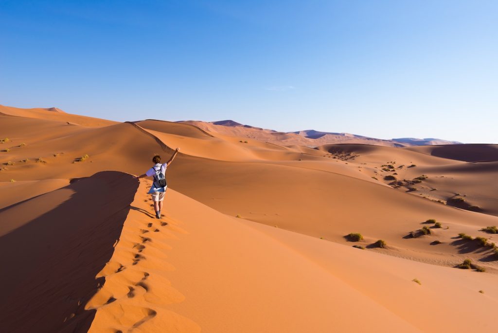 A woman walks along Dune 45 in Namibia.