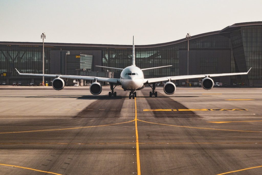 An aeroplane parked at an airport.