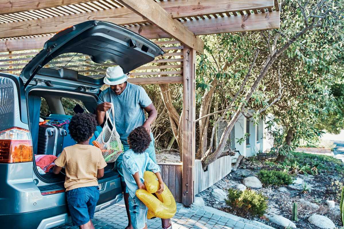 A family gets ready for a road trip.