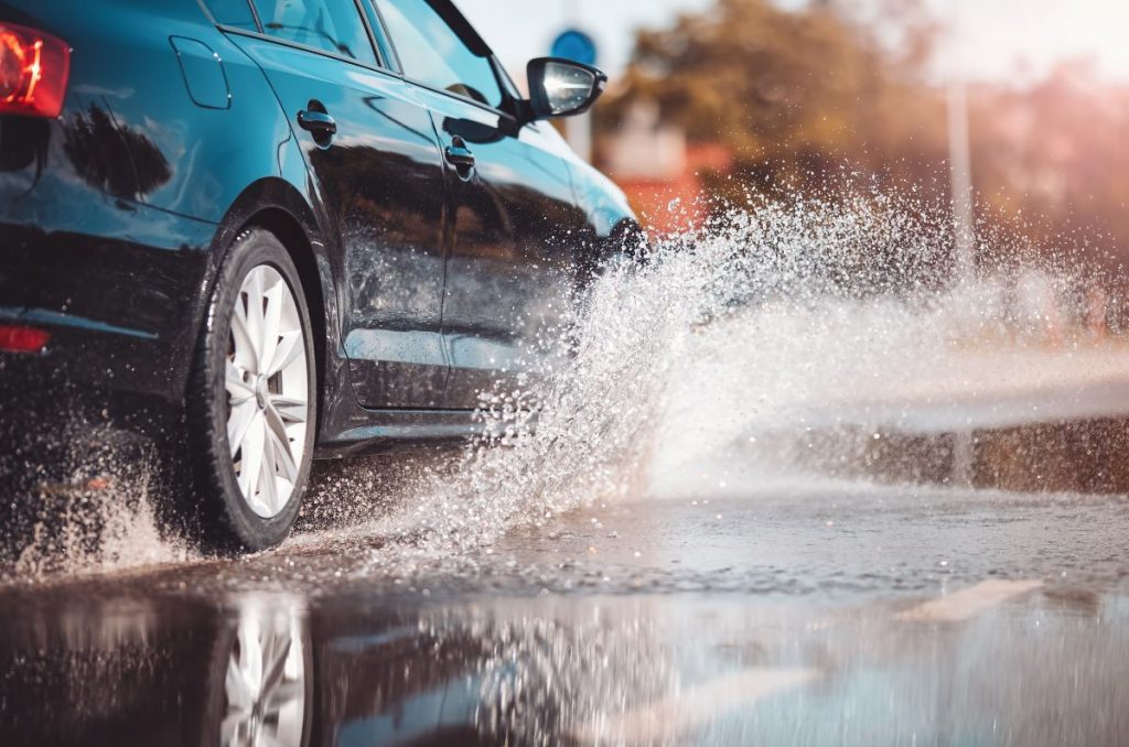 A car driving through water.