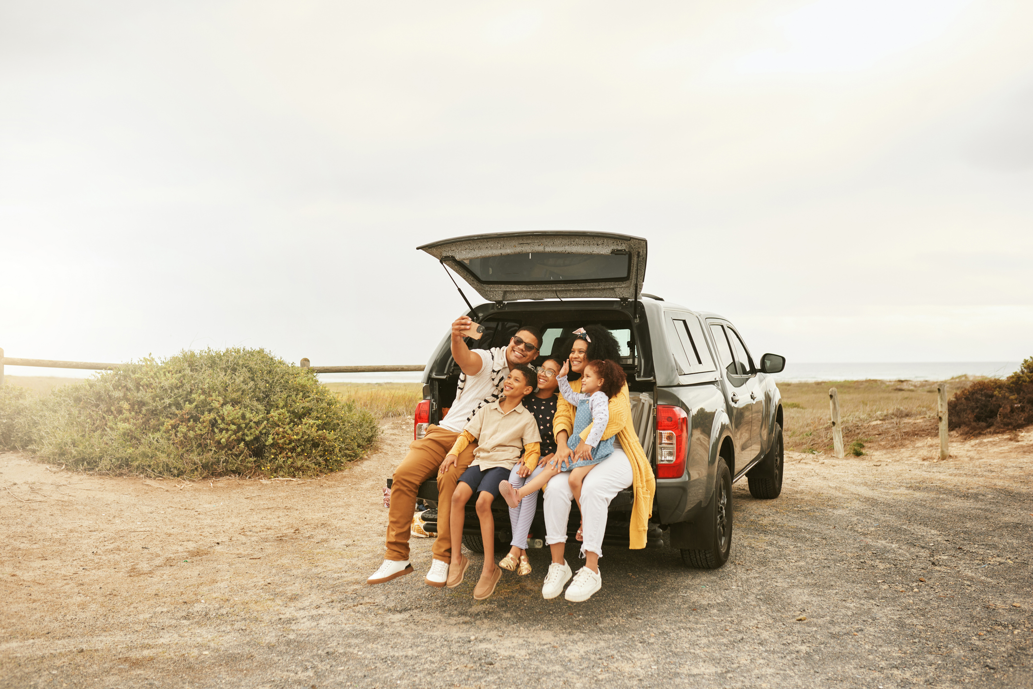 Family taking a selfie on a roadtrip. Photo: Getty Images