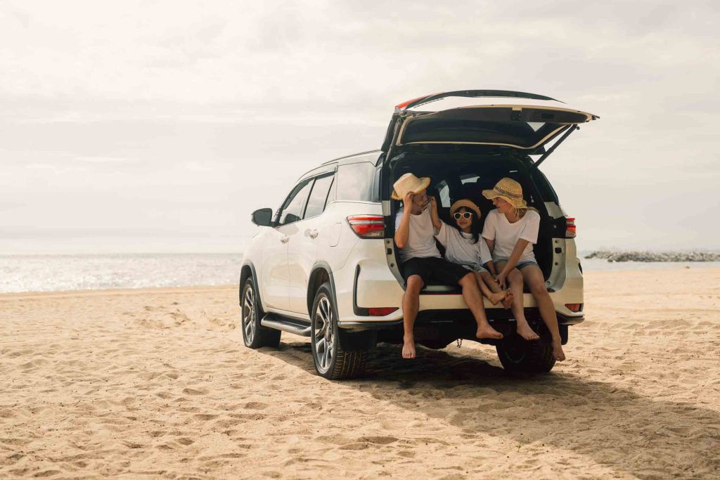 Happy family travel on beach.