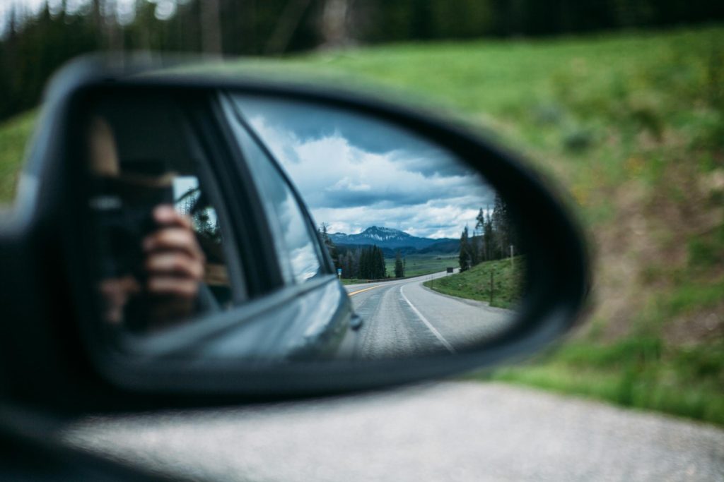 Taking a photo of a side mirror.