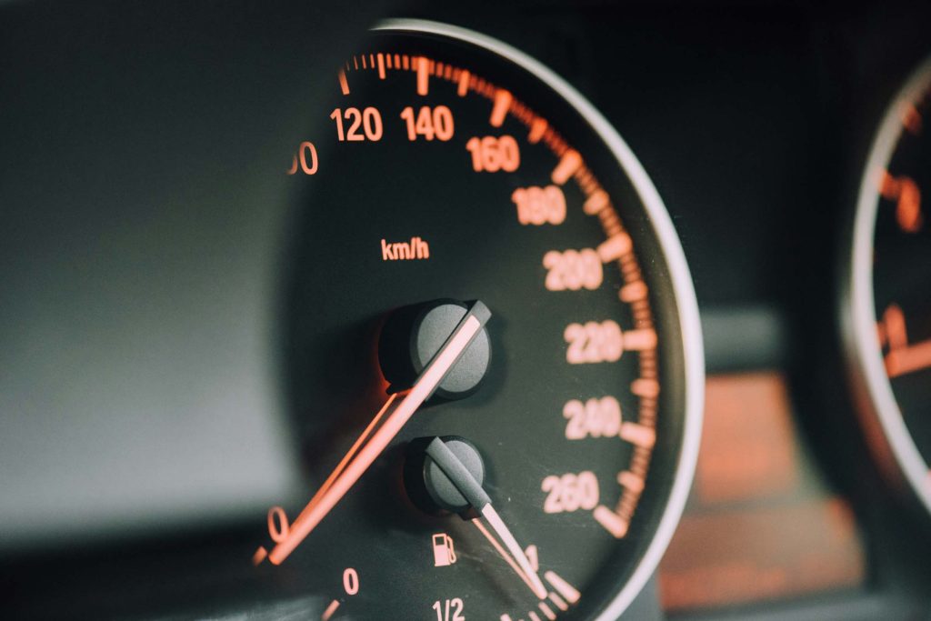 A car's odometer and speedometer.