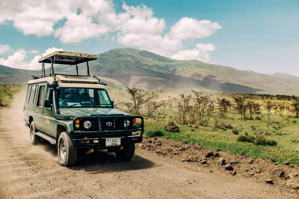 A Toyota Land Cruiser safari vehicle driving.