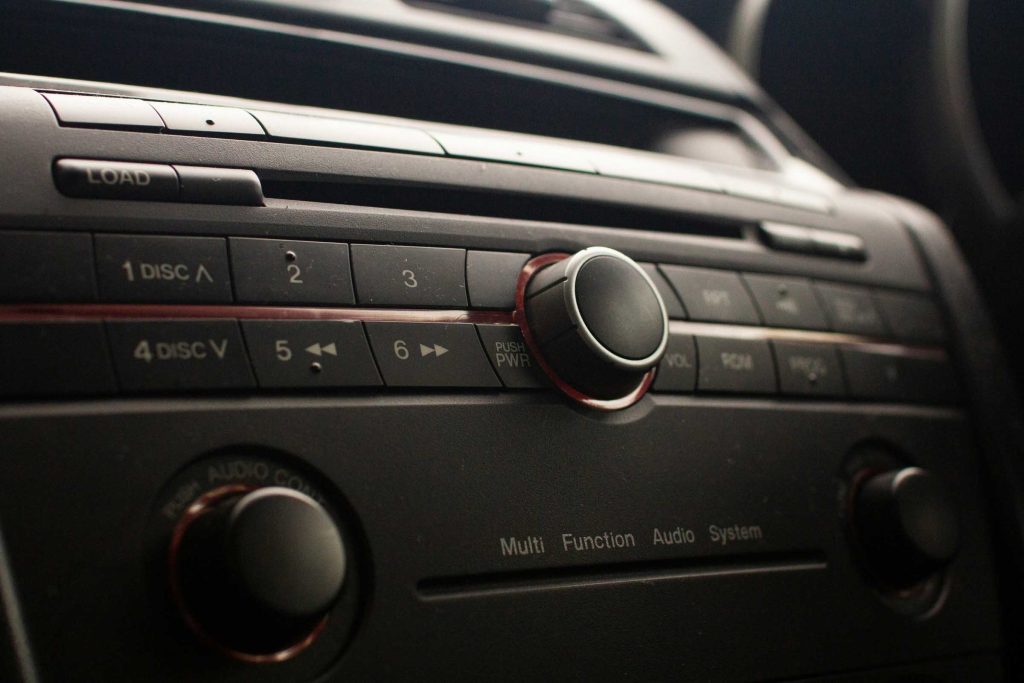 A car radio with physical button.