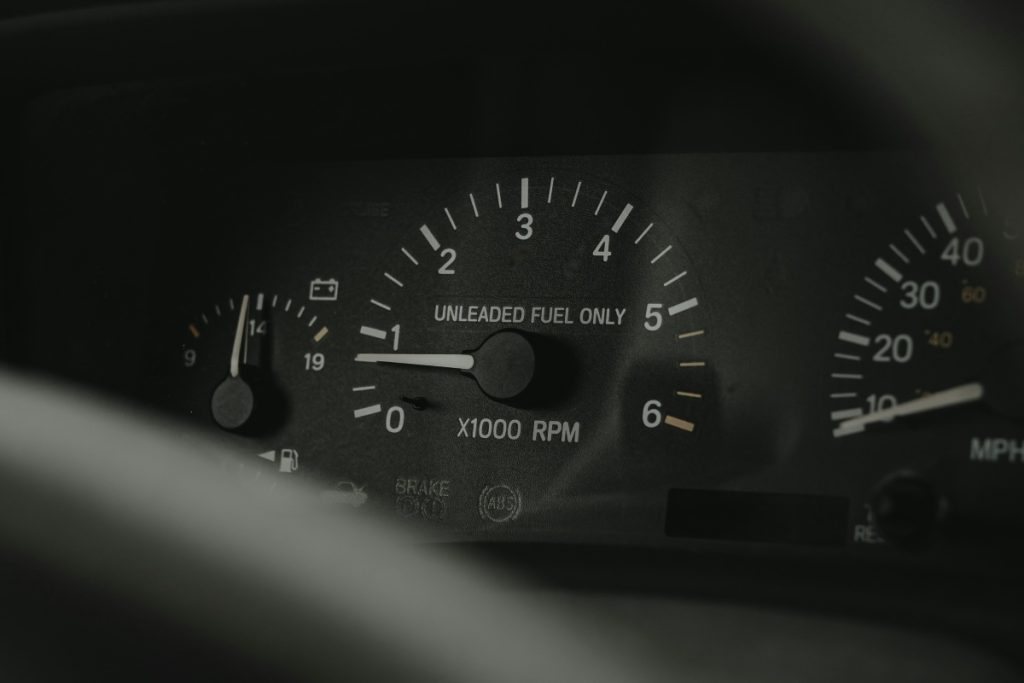 A fuel gauge in an older car.