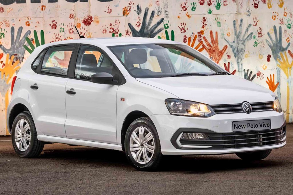 A white Polo Vivo against an arty background.