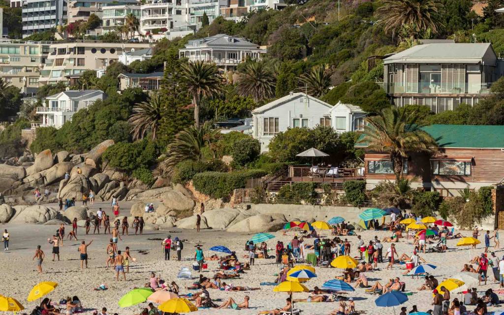 People sunbathing on Clifton 4th Beach in Cape Town.