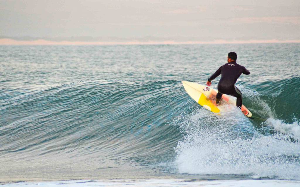 A surfer catches a wave in Jeffreys Bay.