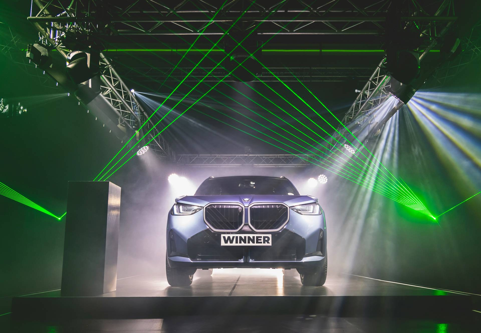 BMW X3 on a stage with concert lighting