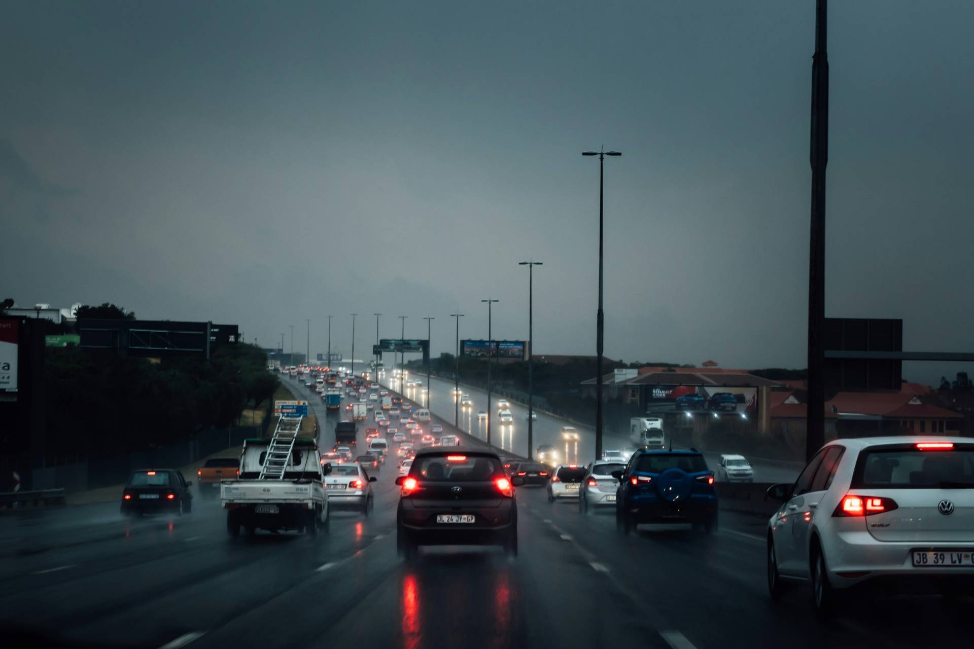 Highway filled with cars on a rainy afternoon