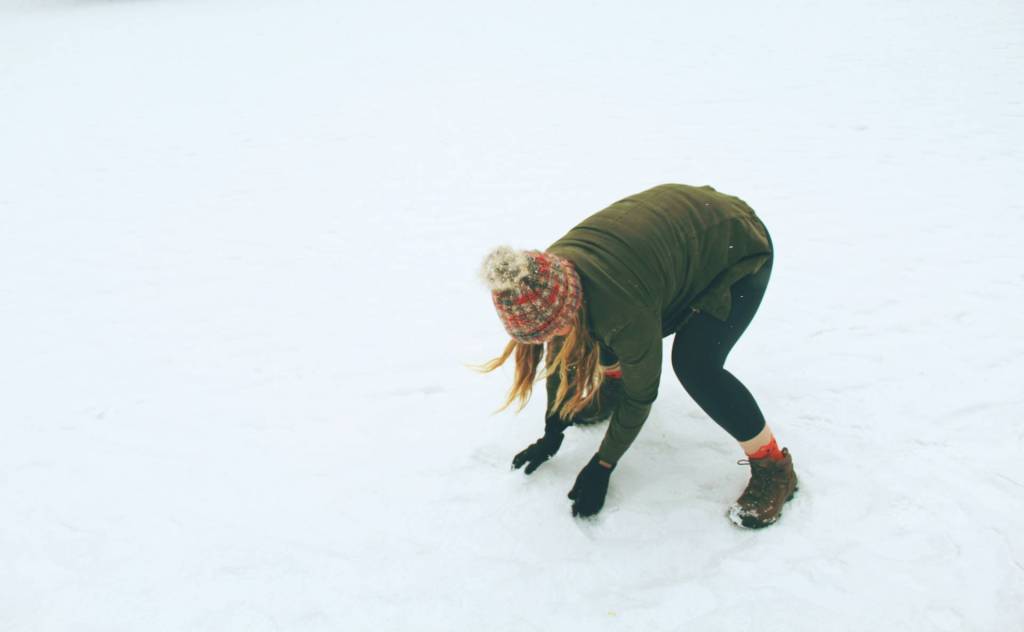 Woman playing in the snow