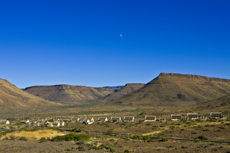 View of the Dutch styled chalets with the mountains as a backdrop at Karoo National Park