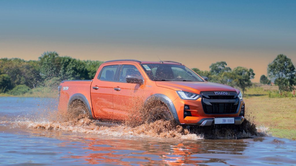 A 4x4 vehicle crossing a river.